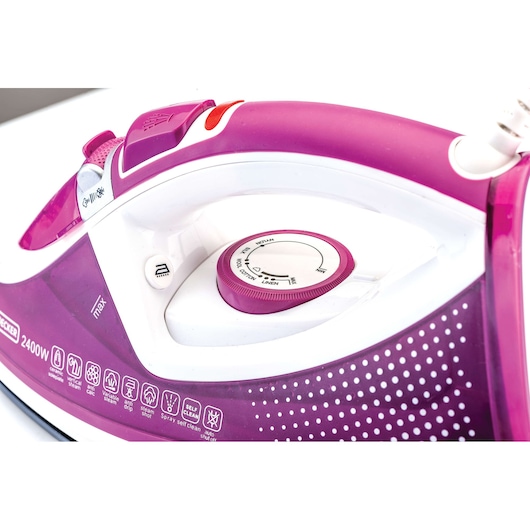 BLACKDECKER X2450 purple and white steam iron close-up, showing control dial and buttons, side angle.