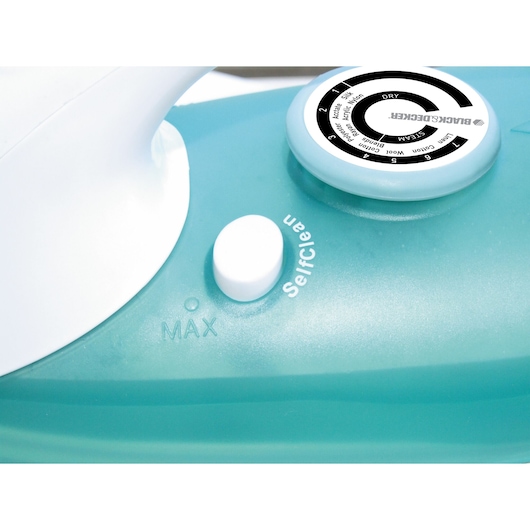 BLACKDECKER X810R steam iron control dial and self-clean button, close-up angle, teal body.
